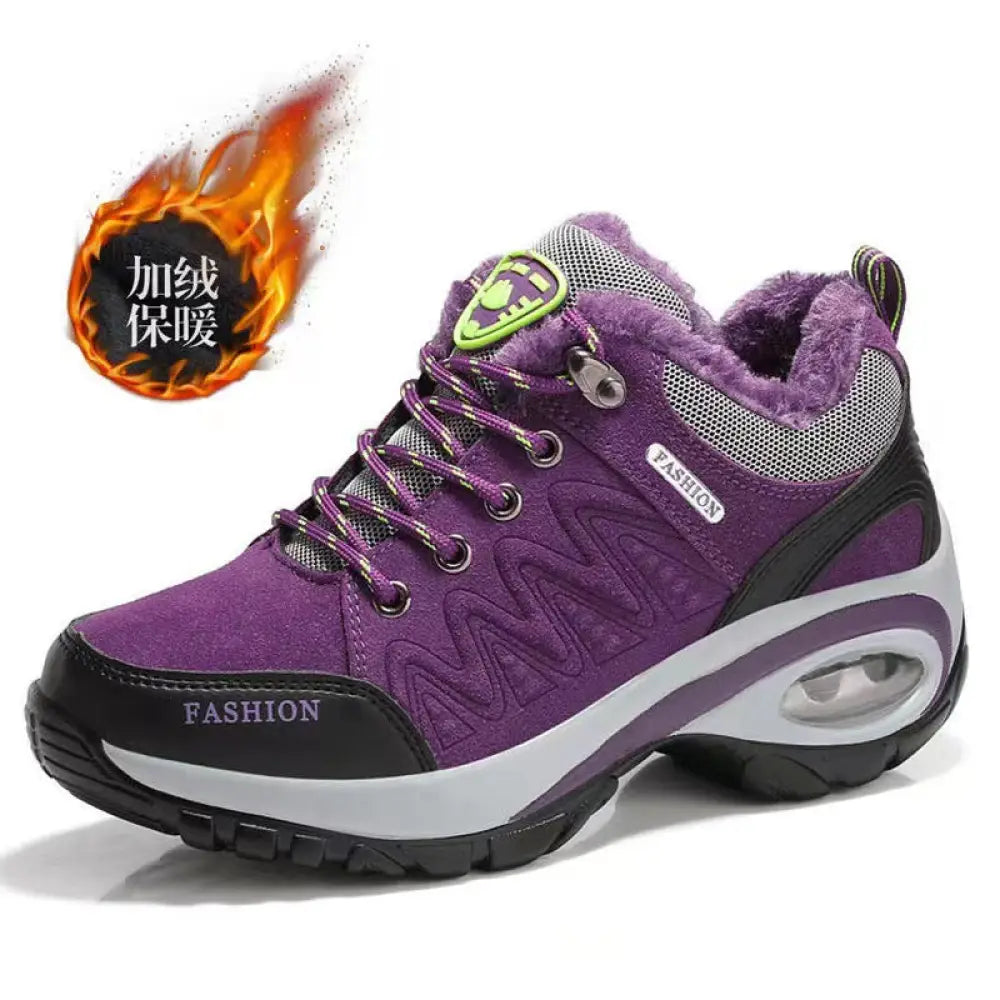 Women’s purple and black insulated hiking shoe with plush lining mesh upper and air cushioning sole for athletic use