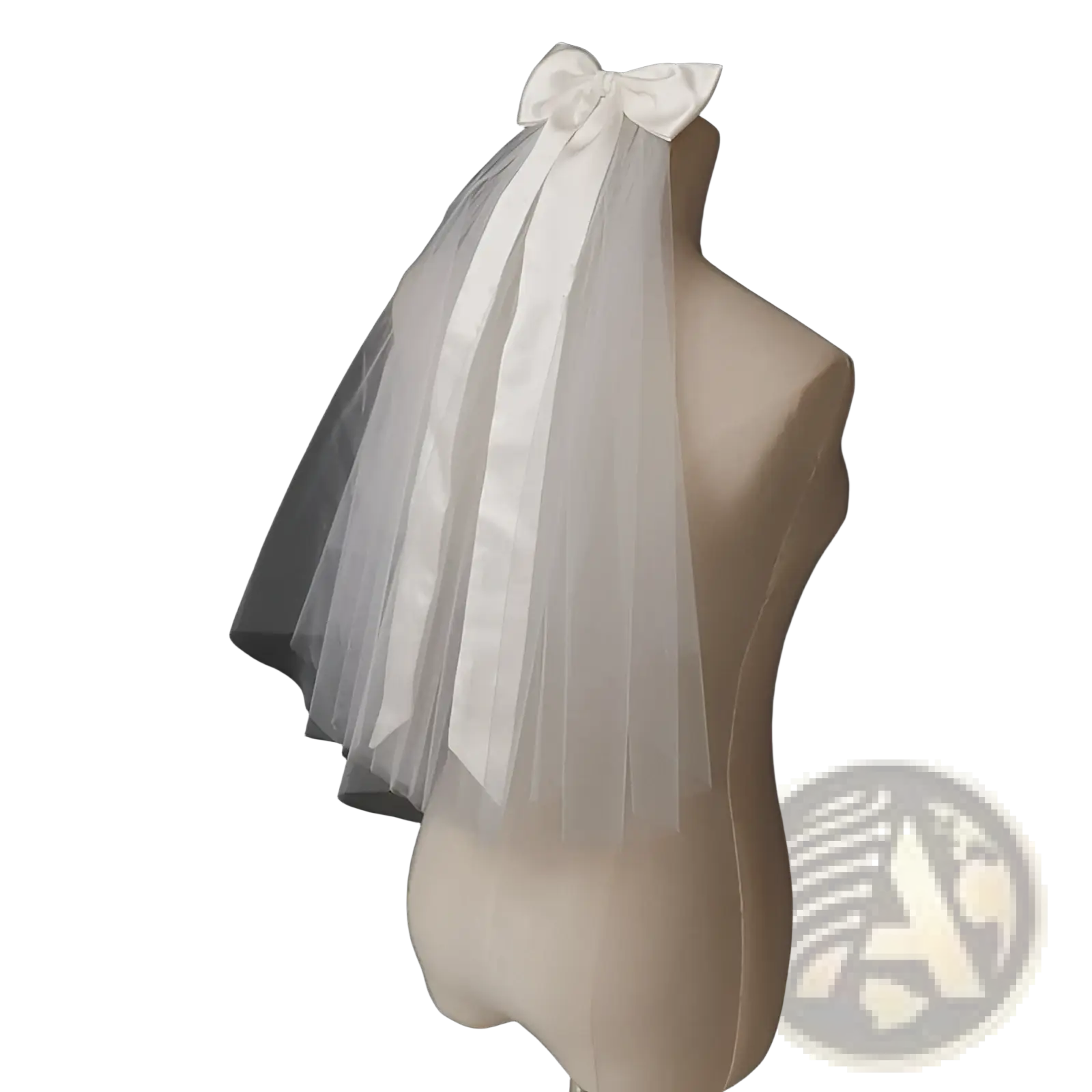 Short bridal veil made of delicate white tulle adorned with a satin bow and silver hair comb for weddings