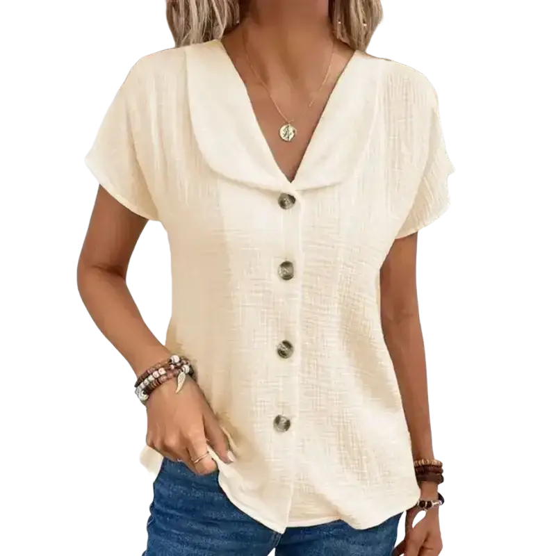 Cream-colored solid short sleeve blouse with textured fabric and dark buttons ideal for summer casual wear