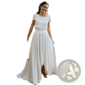 White lace and satin short sleeve wedding dress with jewel neck and high-low hemline shown from the back
