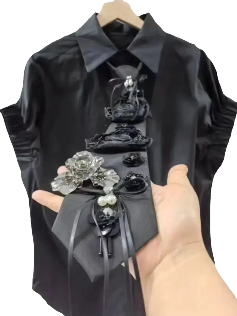 Black satin short sleeve shirt for women with decorative floral and beaded embellishments along the front