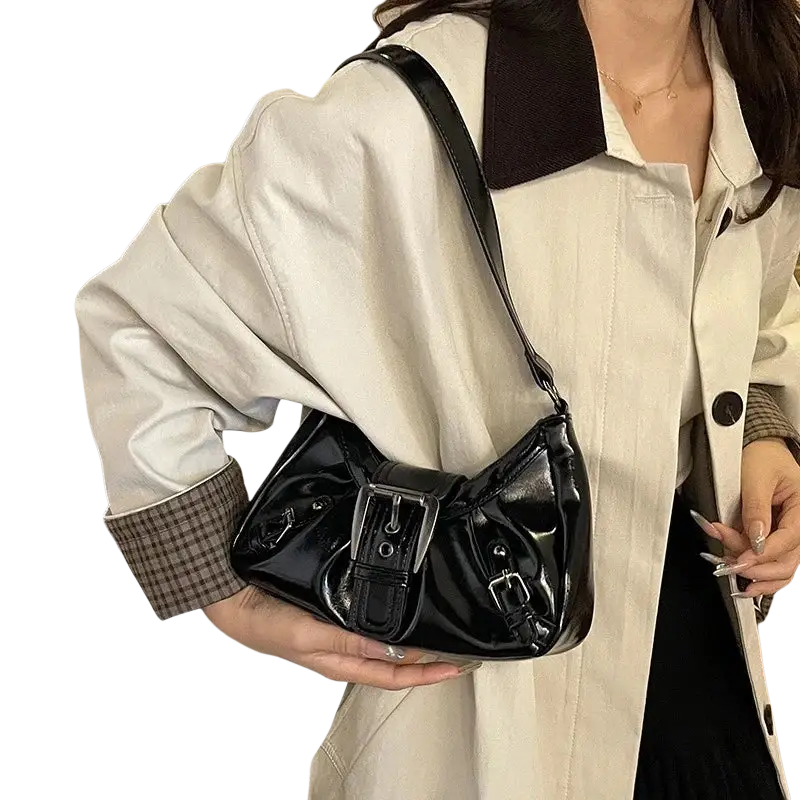 Black glossy patent leather shoulder bag with silver-toned buckle closure perfect for women’s everyday use