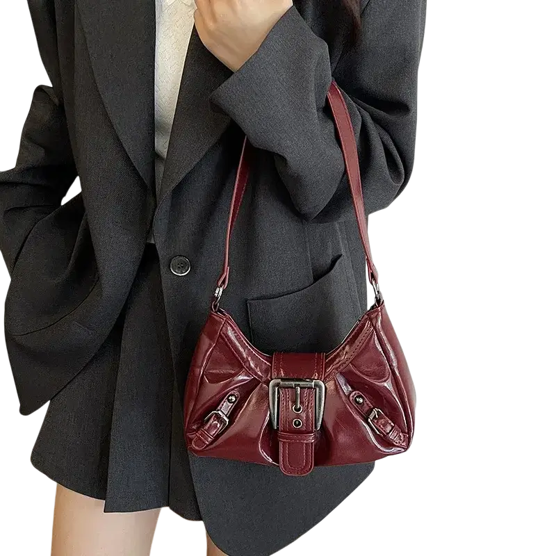 Glossy burgundy patent leather shoulder bag with silver buckle and matching straps for women