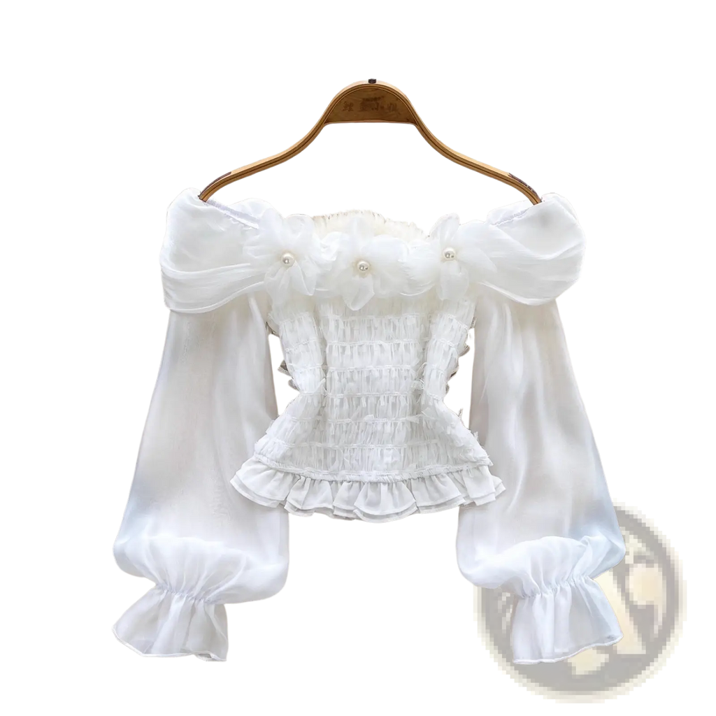 White off shoulder blouse with sheer puff sleeves ruffled hem smocked bodice and pearl like bead embellishments