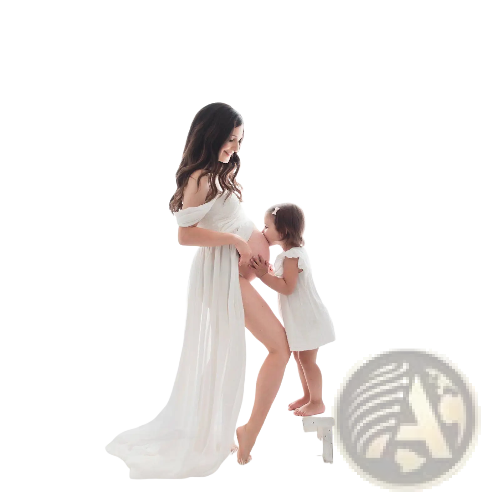 A flowing white chiffon maternity gown with off the shoulder sleeves and a soft draped silhouette for photoshoots