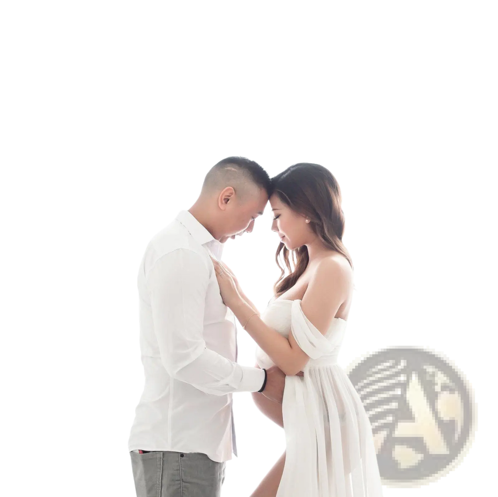 A flowing white off the shoulder chiffon maternity gown with soft draped fabric and gentle ruching for photoshoots