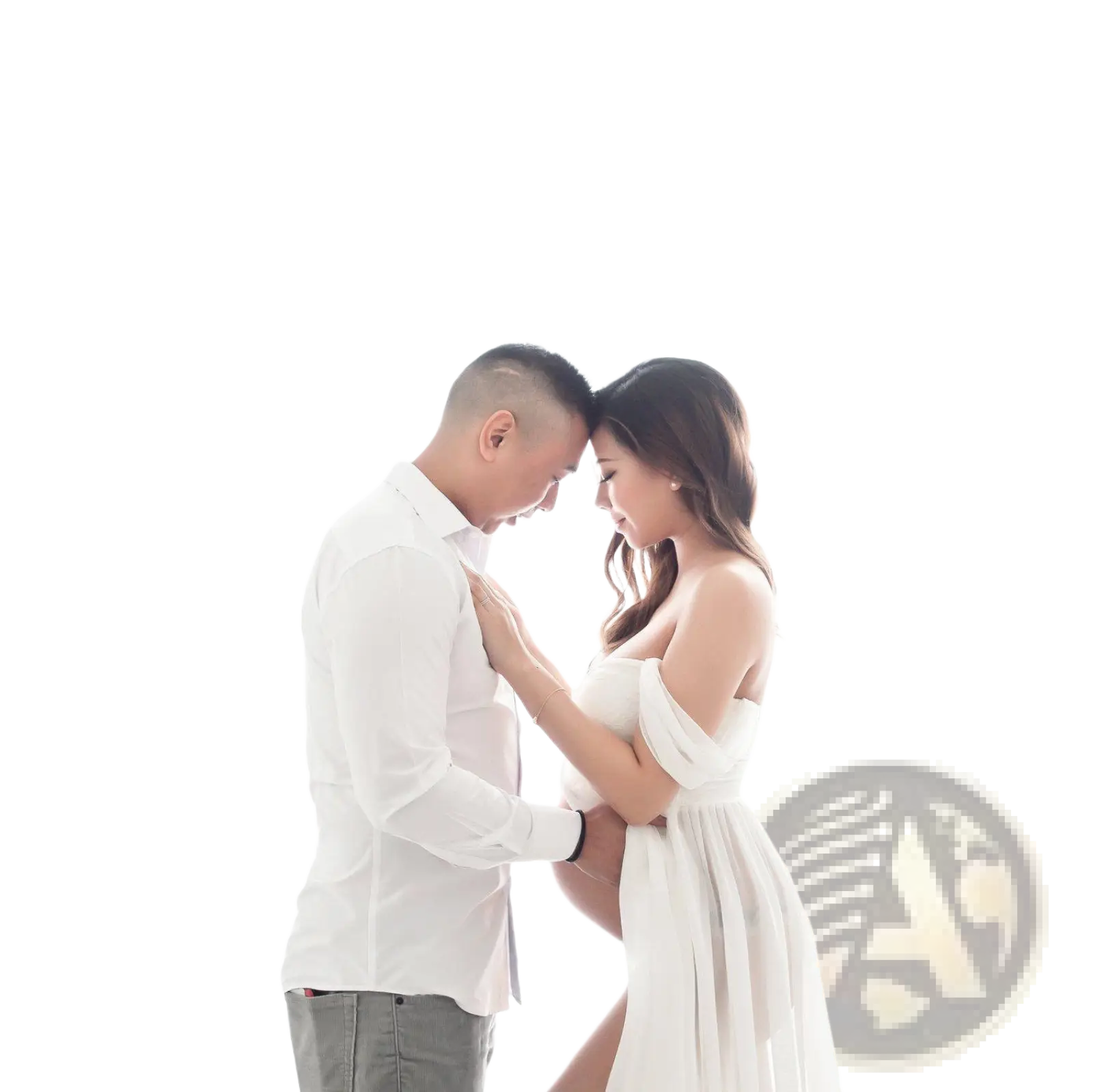 A flowing white off the shoulder chiffon maternity gown with soft draped fabric and gentle ruching for photoshoots