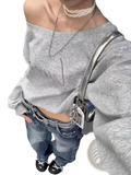 Off shoulder gray sweatshirt featuring silver rhinestone lettering across the chest for stylish casual wear