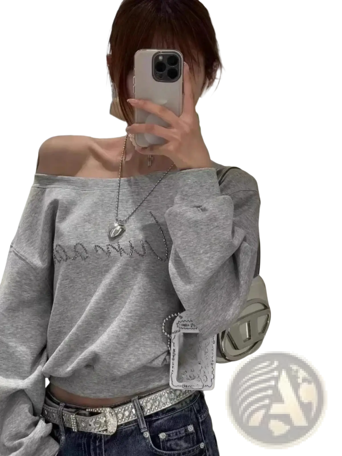 Silver chain necklace with heart-shaped pendant displayed with off shoulder gray rhinestone sweatshirt