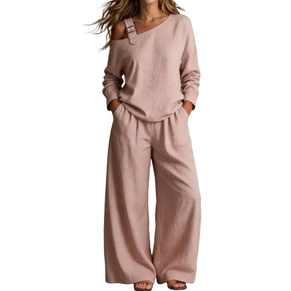A soft blush pink linen off shoulder long sleeve two piece lounge set with rolled sleeves and wide leg pants length
