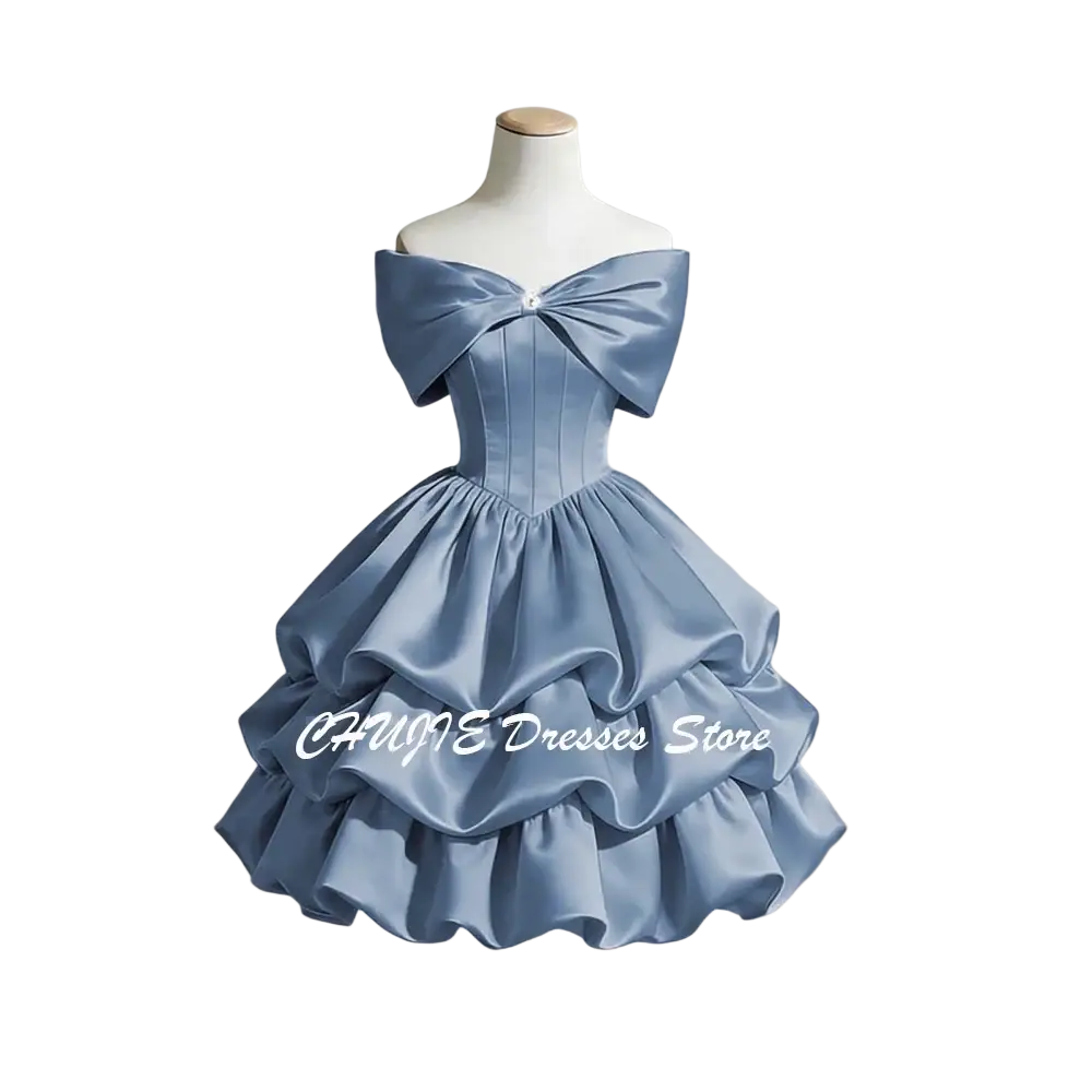 A light blue satin off-shoulder tiered graduation dress with a structured bodice and ruffle skirt