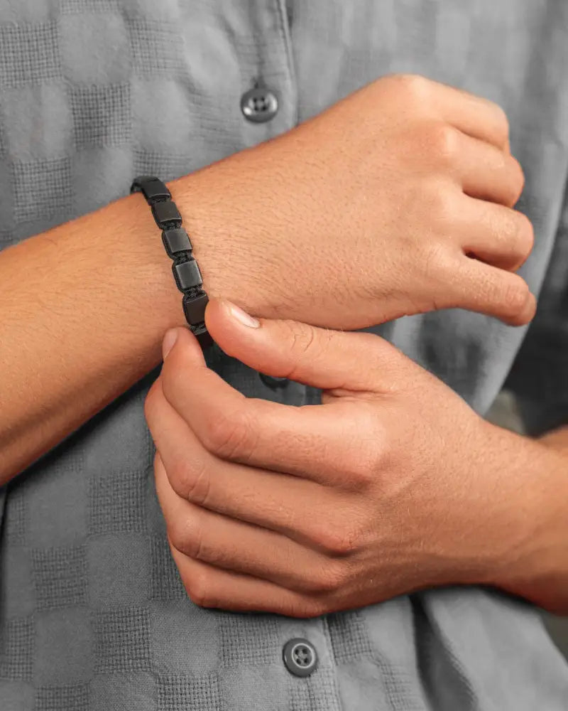 Black magnetic therapy bracelet with rectangular matte-finished shungite stone segments for EMF protection