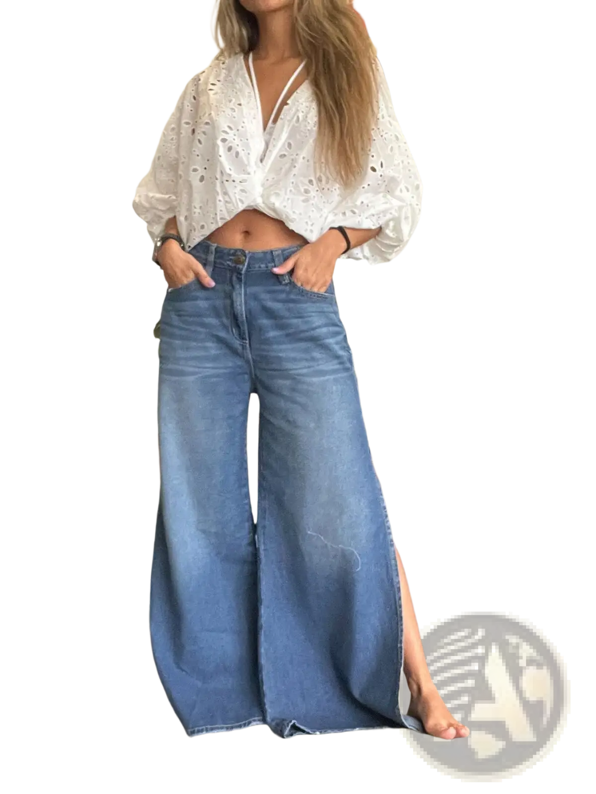Wide-leg blue denim jeans with side slit and raw hem showcasing casual stylish design