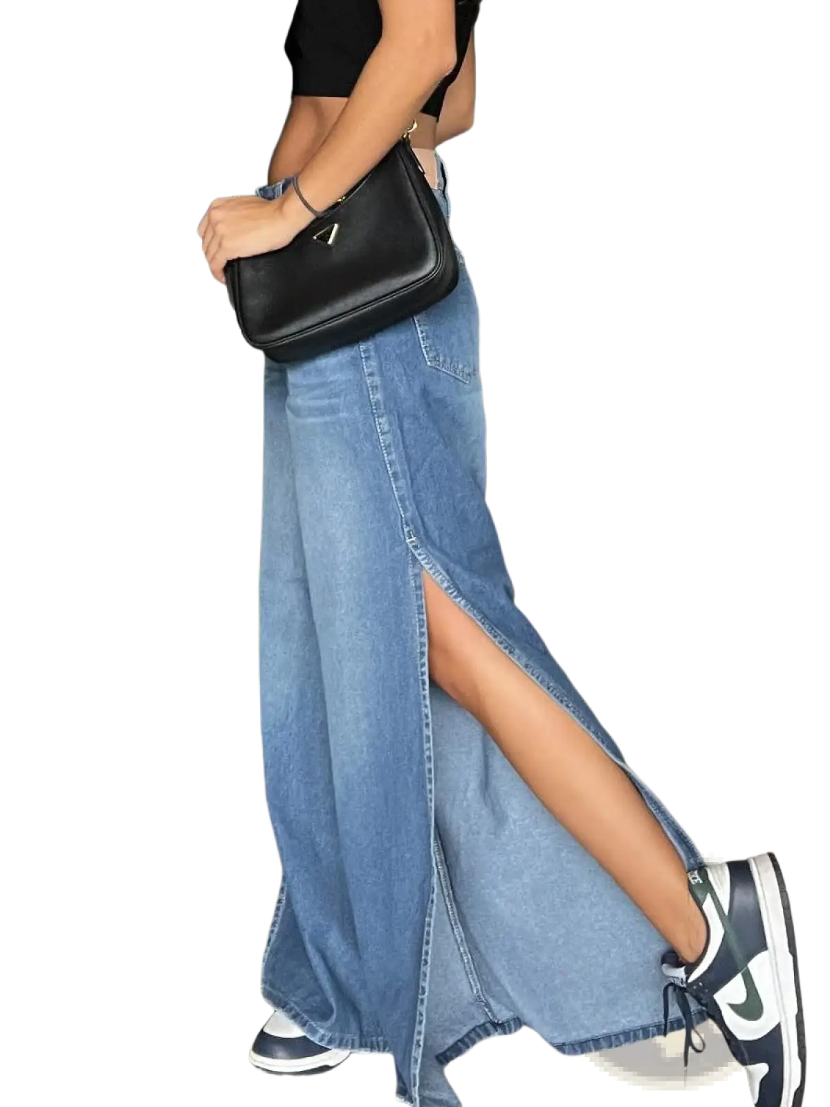 Black leather crossbody bag with triangular logo detail paired with side slit wide leg denim jeans visible from front