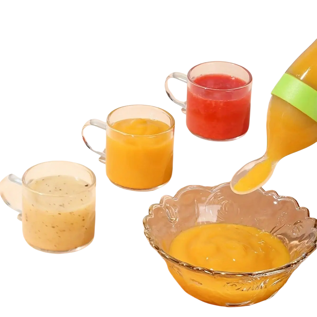 A clear glass pitcher with a bright green silicone grip pouring orange puree into a scalloped glass bowl