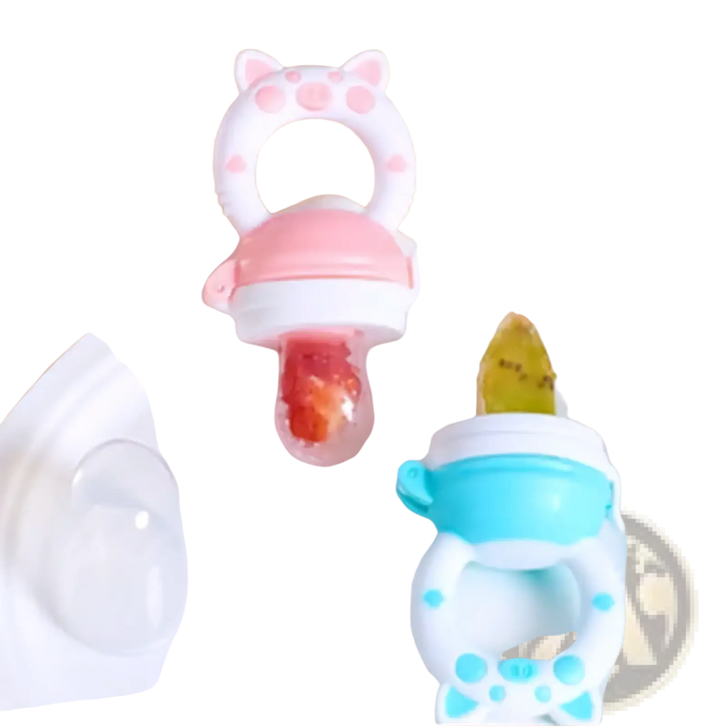 Silicone baby fruit feeder and teether set in pink and white with cat design and clear fruit compartment made of silicone