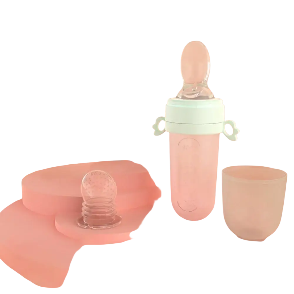 Pastel pink silicone baby squeeze feeding bottle with mint green accents and clear spoon attachment for easy feeding