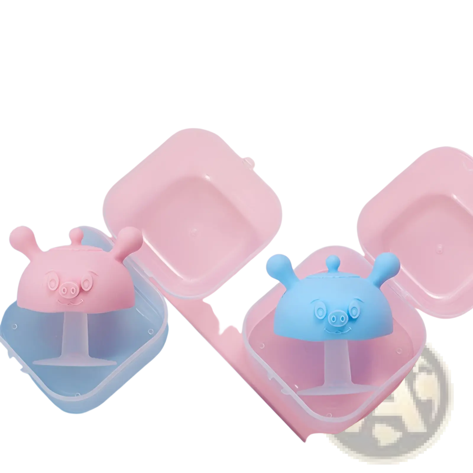 Silicone baby teether and pig shape toothbrush holders in pink and blue silicone inside clear plastic cases
