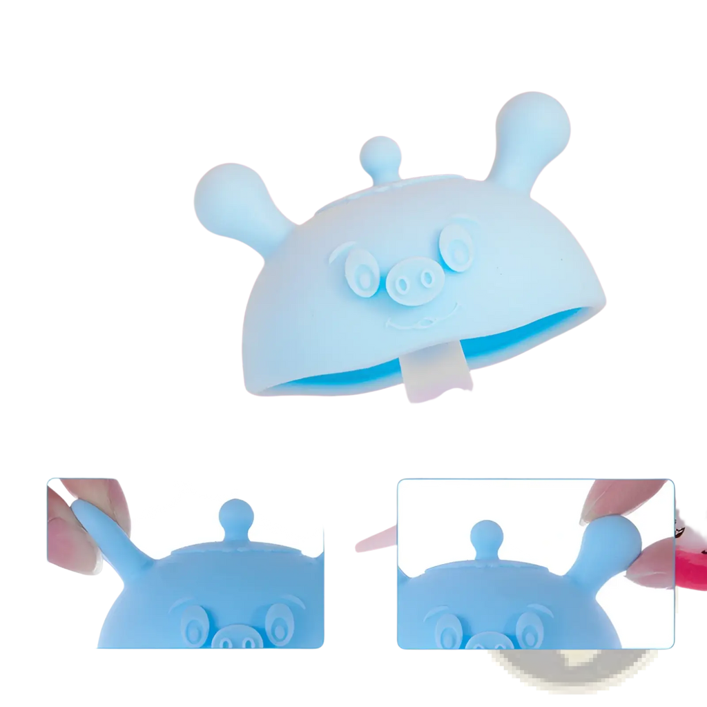 Light blue silicone baby teether shaped like a pig with three antennae serving as an ice pop mold and toothbrush holder