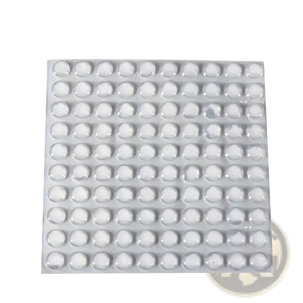 A sheet of 100 clear silicone bumpers transparent round dome shaped protective furniture pads arranged in a grid pattern