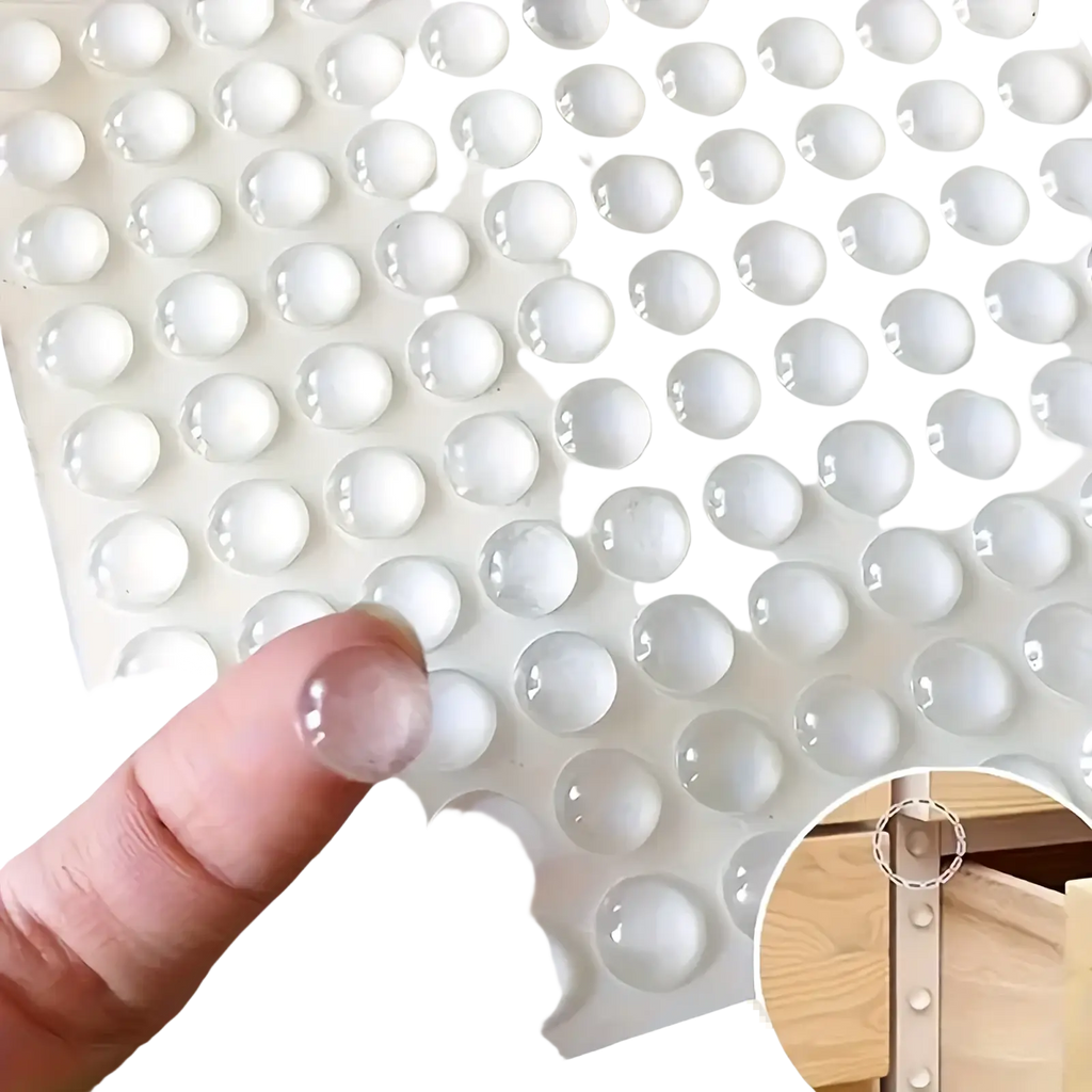Clear round transparent silicone bumpers arranged in a grid on white backing sheet for furniture protection pads
