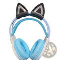 Light blue and white over-ear headphones with black silicone cat ear attachments on the headband