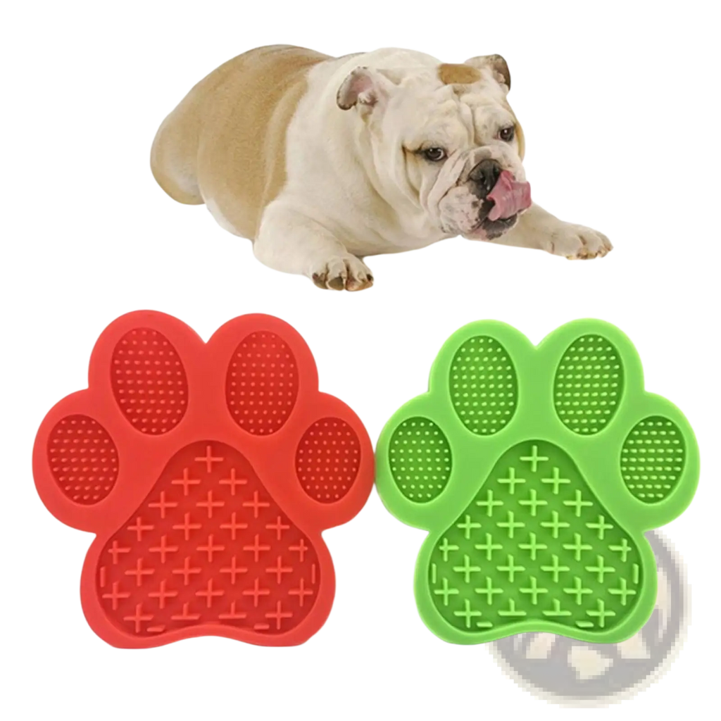 Silicone dog bath lick pad grooming mat with red and green paw-shaped textured surfaces for nail trimming and scratching