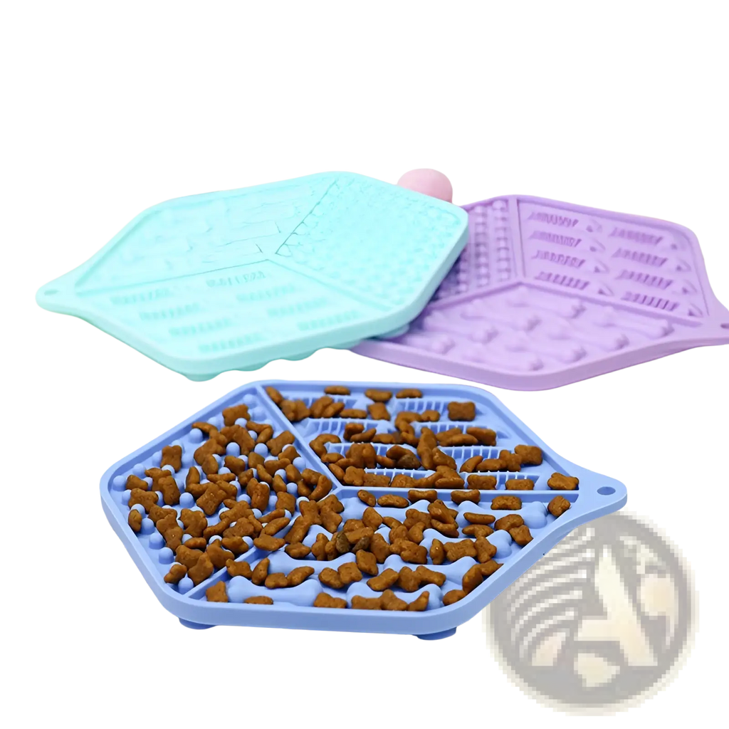 Blue hexagonal silicone dog lick mat puzzle feeding pad filled with brown kibble for interactive pet feeding