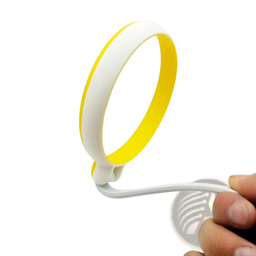 A sleek white and yellow silicone egg ring round omelette mold with handle and a flexible minimalist wristband design