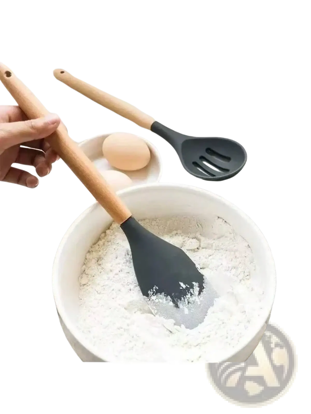 Black silicone spatula with wooden handle resting in a white bowl of flour from silicone kitchen utensil set
