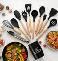 Black silicone and wood heat resistant cooking utensil set with light wood handles arranged in a set