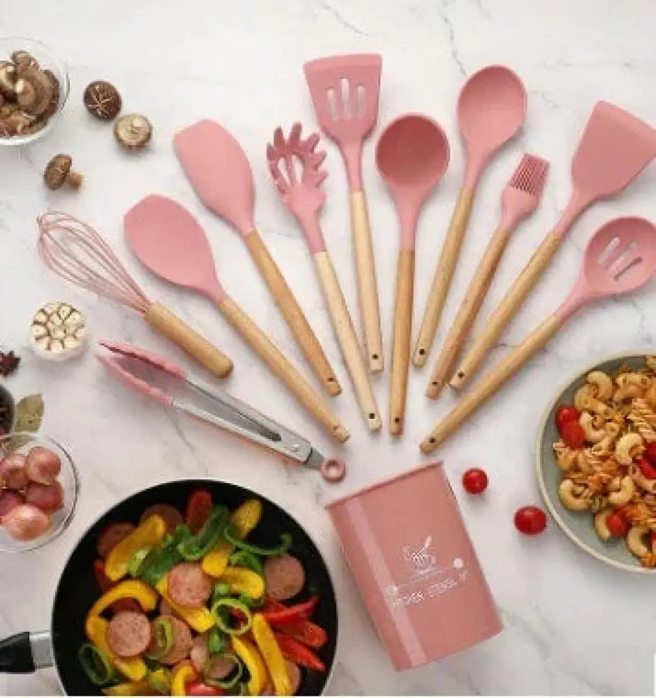 Pink silicone and wood heat resistant cooking utensil set with wooden handles for kitchen use