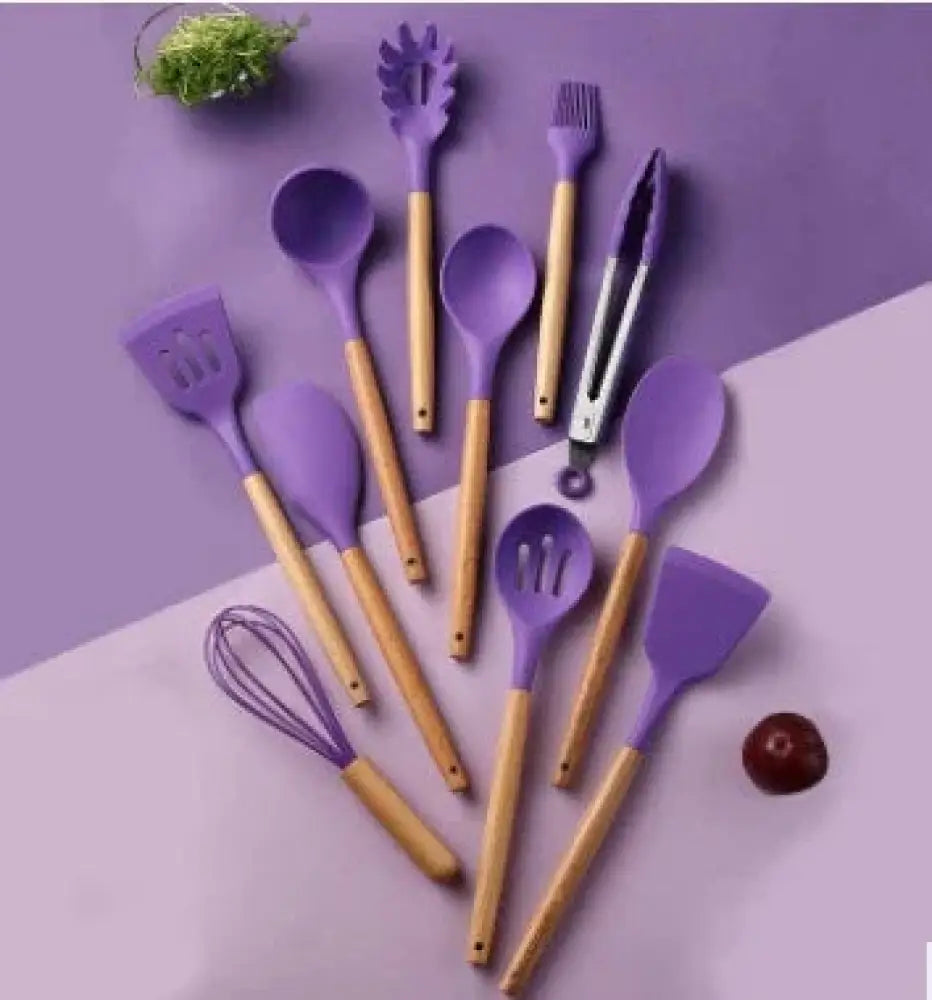 Purple silicone and wood heat resistant cooking utensil set with wooden handles arranged in a set