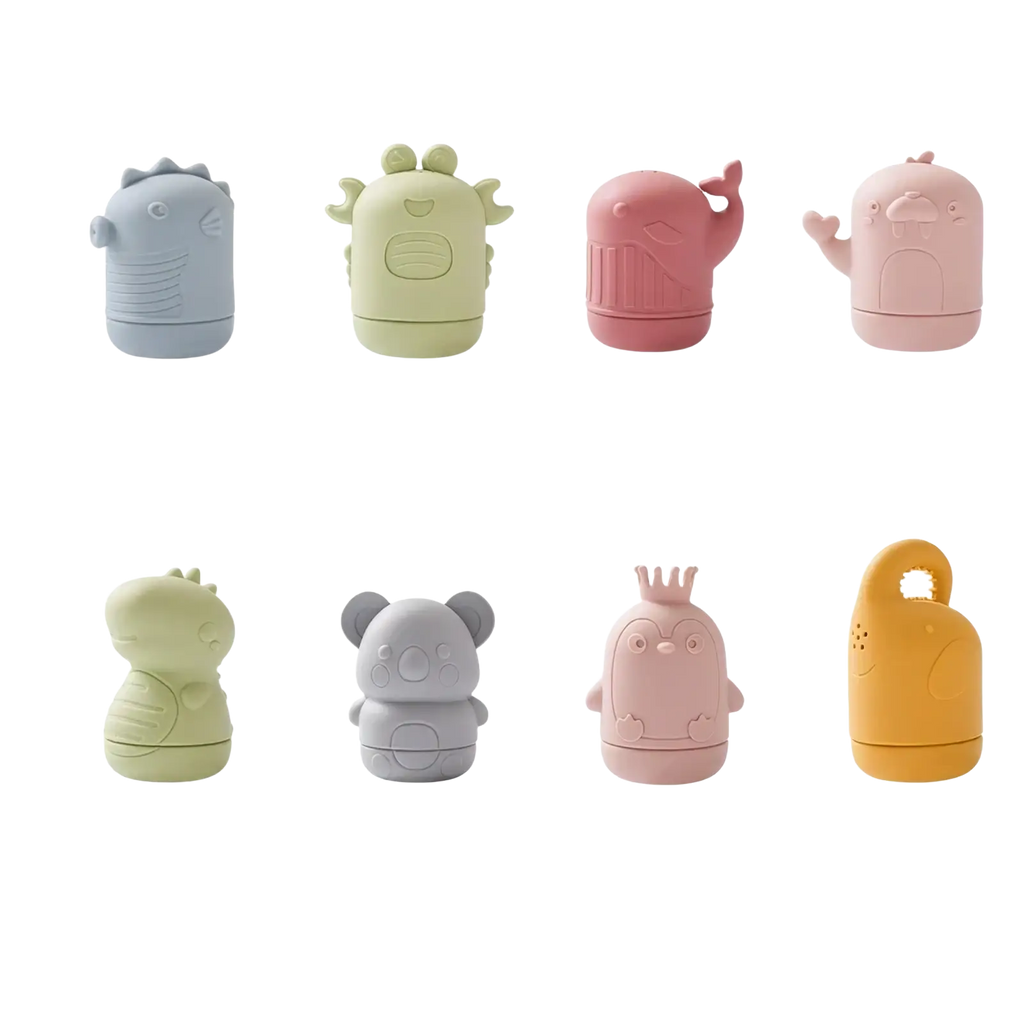 Set of eight pastel-colored soft silicone travel toiletry containers shaped like cute animals including dinosaurs and whales