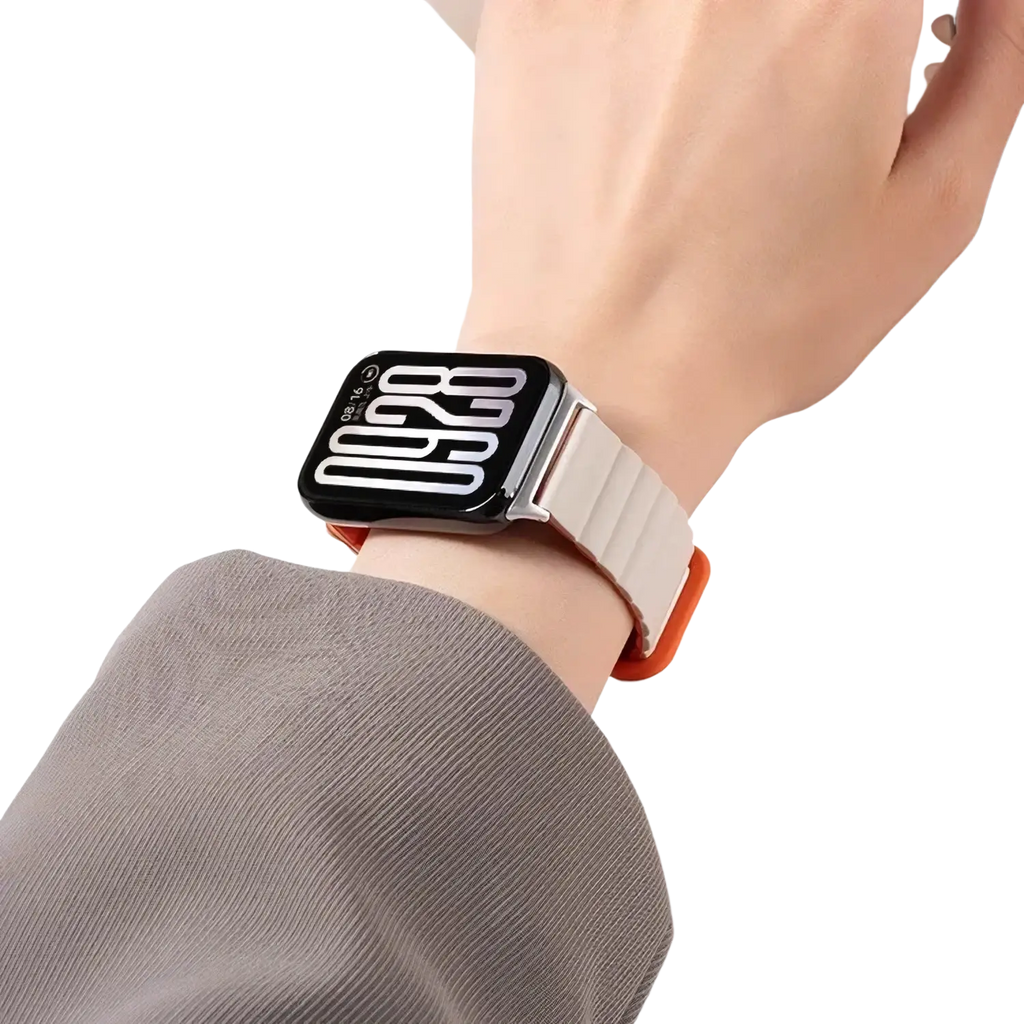 A sleek black smartwatch with a white digital display and an orange-accented silicone magnetic band for Xiaomi Redmi Watch