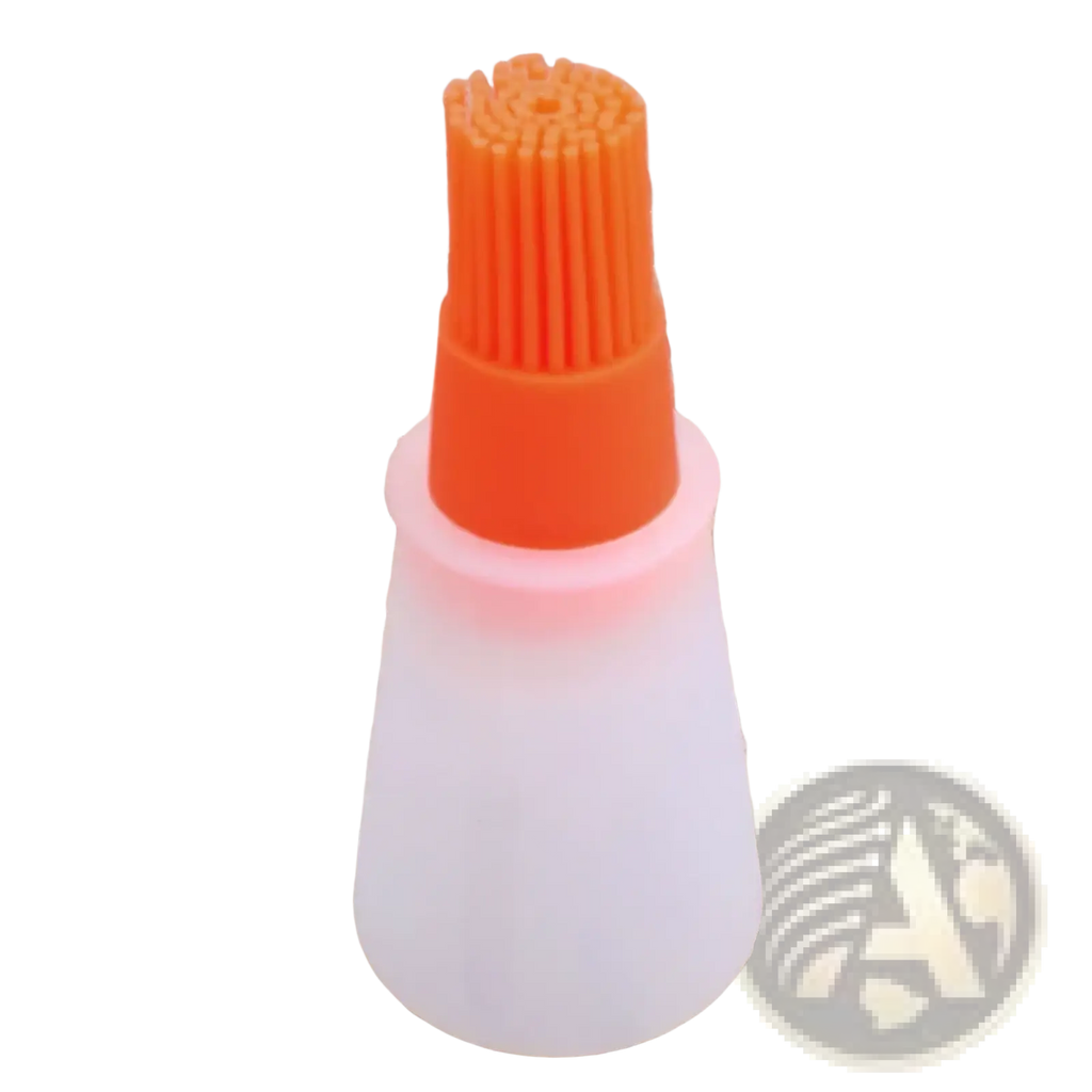 Orange silicone oil dispenser brush with translucent white plastic handle for cooking and baking use