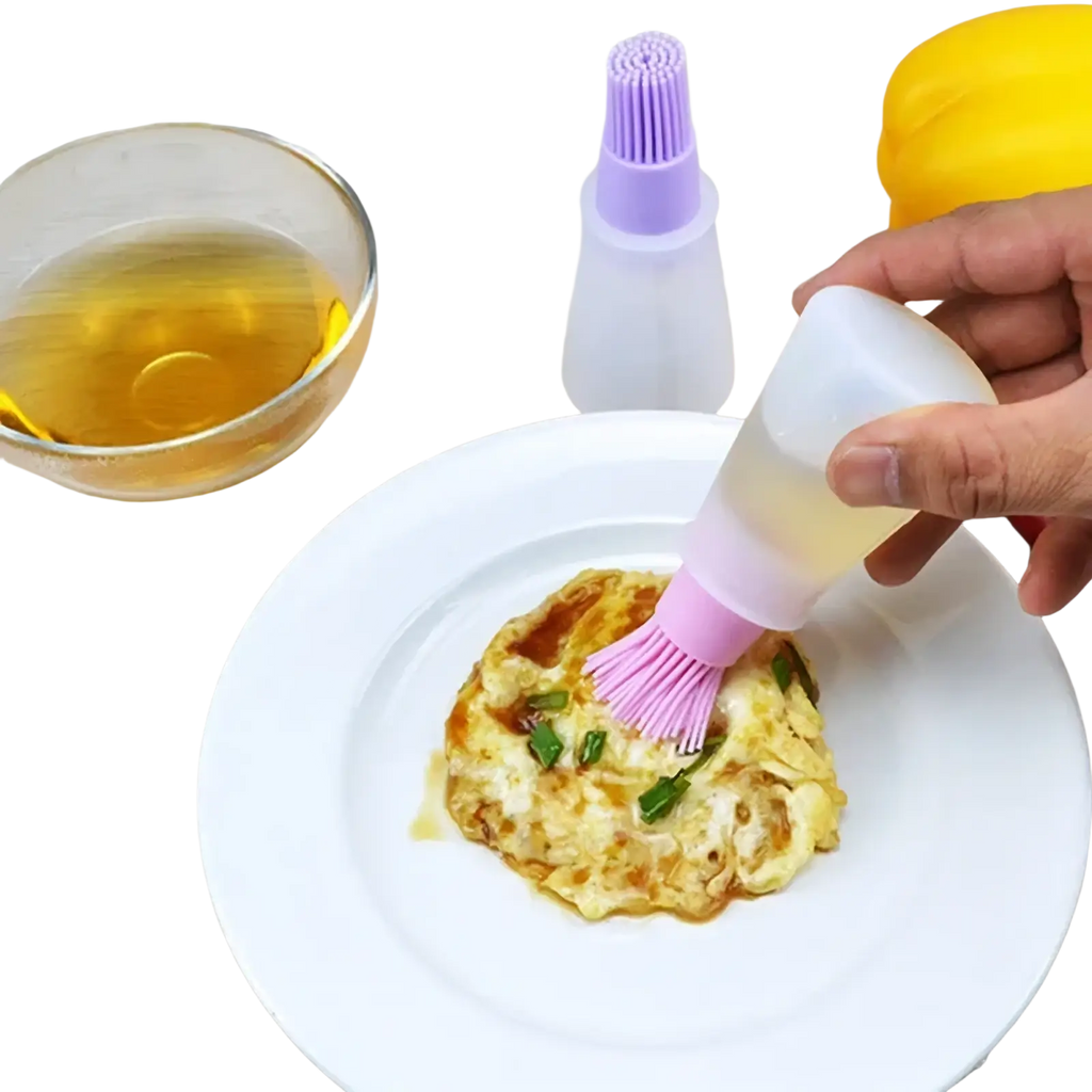 Pink silicone oil dispenser brush with translucent plastic squeeze bottle for cooking and baking use