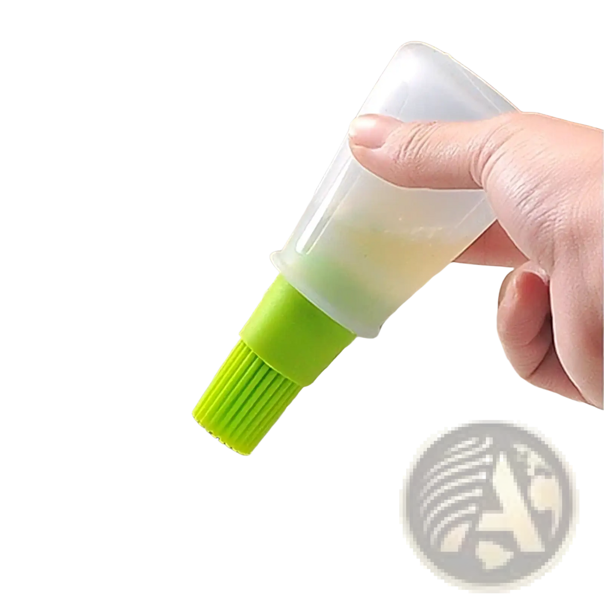 A translucent green silicone oil dispenser brush with a clear plastic squeeze bottle for cooking and baking