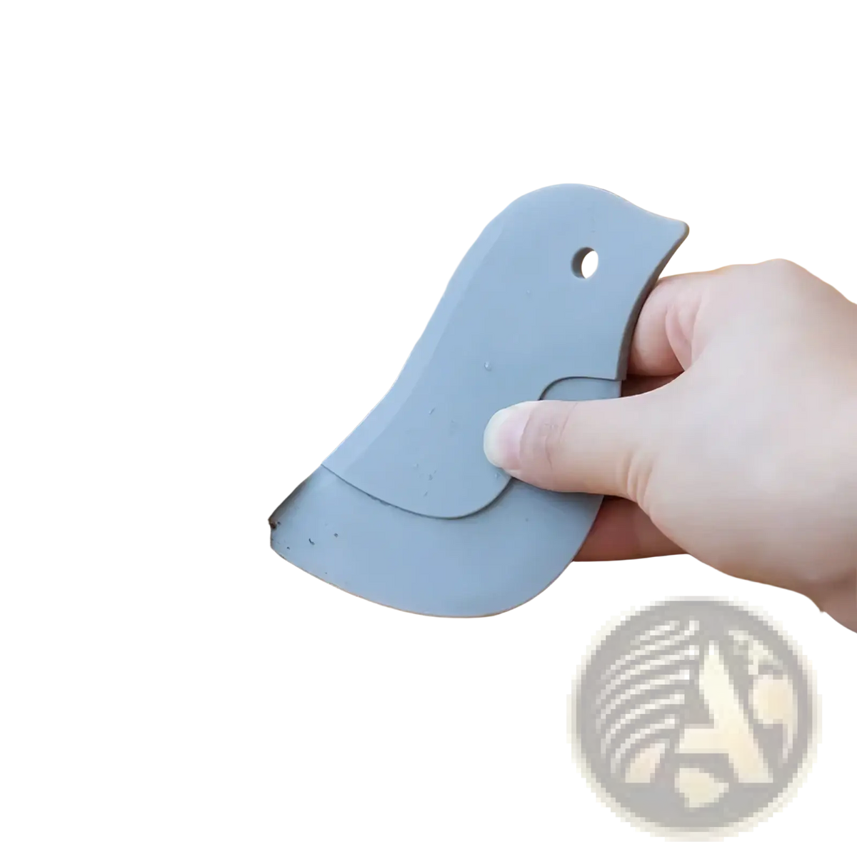 Gray silicone bird-shaped kitchen scraper silicone pan scraper and grease cleaning tool removing debris from countertop edge
