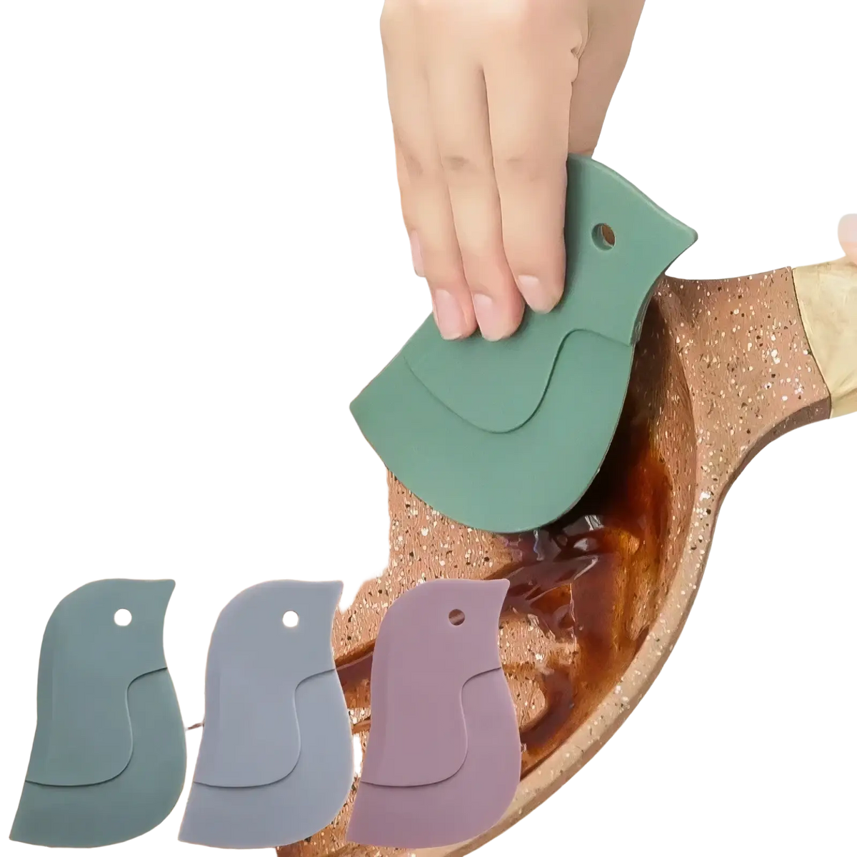 Green silicone bird-shaped silicone pan scraper and grease cleaning tool scraping batter from a pan
