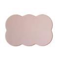 A pale pink silicone pet feeding mat with a soft matte finish and wavy cloud-shaped edges