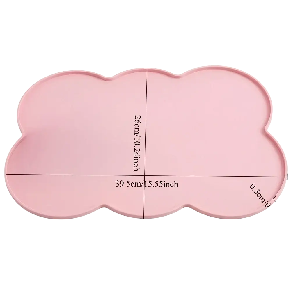 A soft pink cloud-shaped silicone pet feeding mat with smooth edges and a matte finish