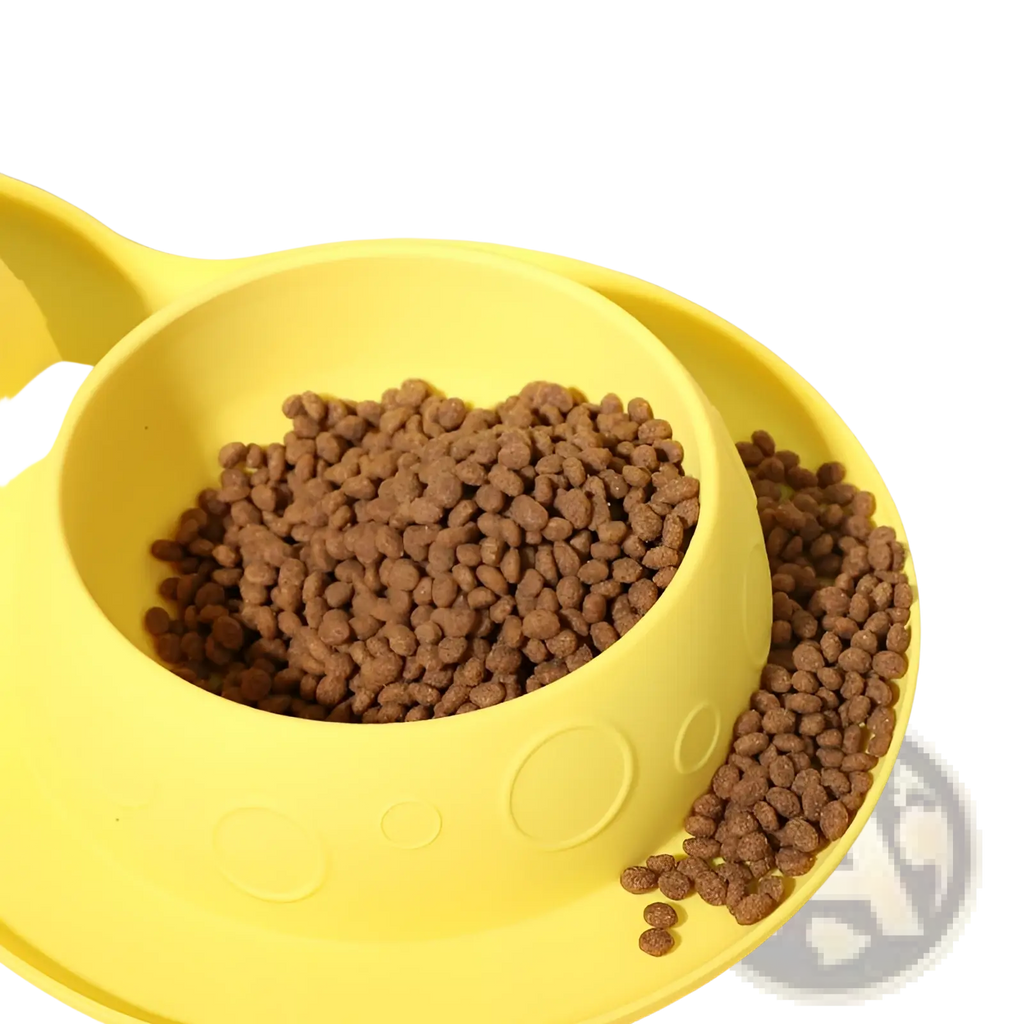 Yellow silicone pet food and water bowl mat set with circular embossed patterns and matching tray for feeding pets