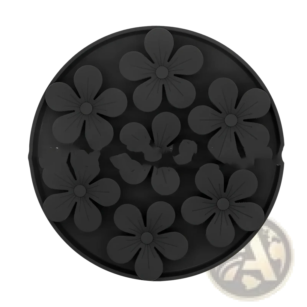 Black circular silicone pet licking mat coaster with raised floral patterns for slow feeder food set use