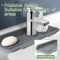 Gray foldable silicone self draining kitchen sink faucet mat with textured grid surface and raised edges for soap holders