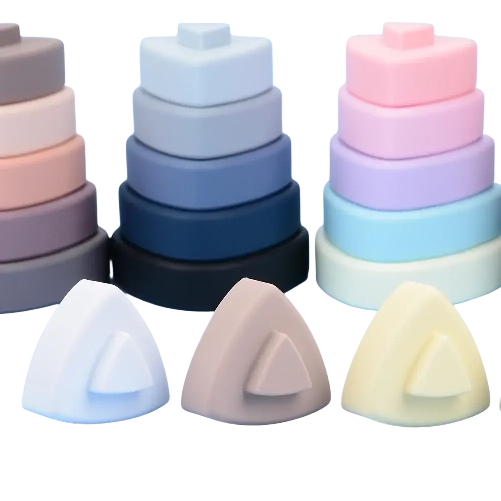 Pastel-colored silicone stacking rings in soft pink blue and beige as part of silicone stacking blocks pastel montessori toys