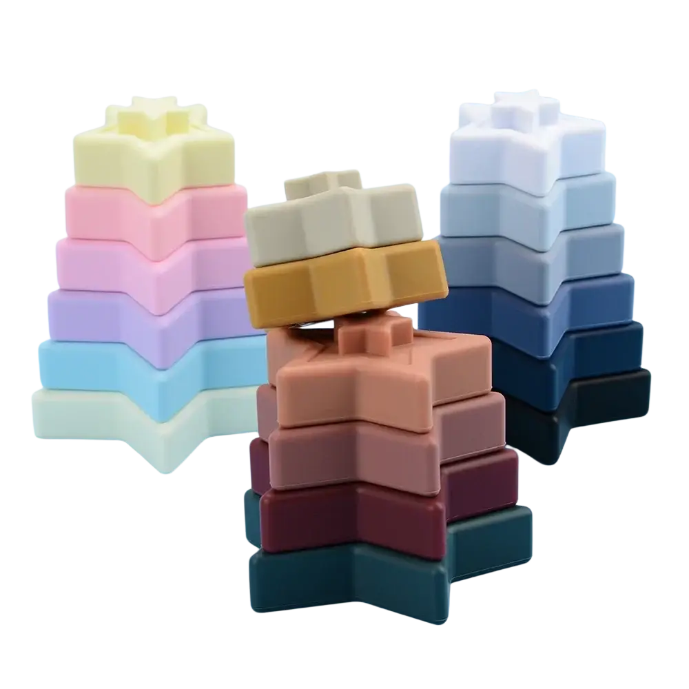 Pastel-colored star-shaped silicone stacking blocks designed as Montessori toys for early childhood development