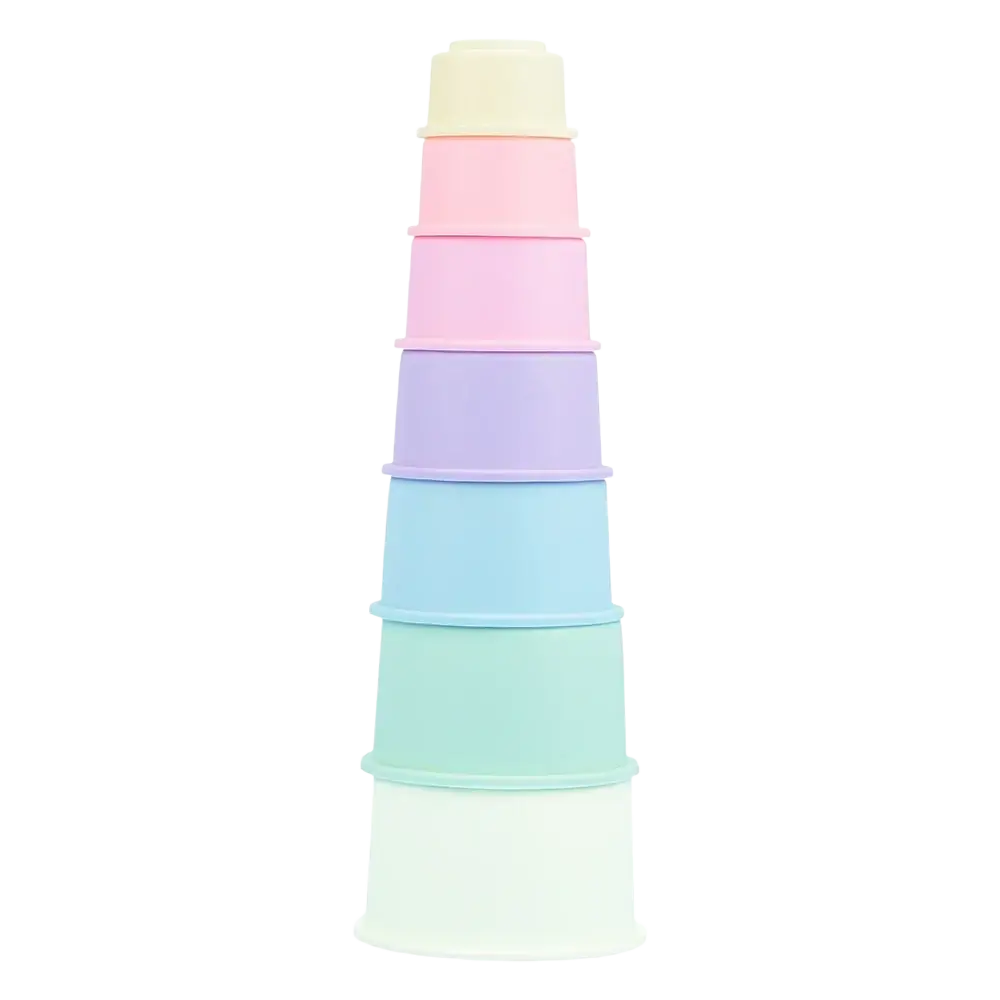 A stack of pastel-colored silicone stacking blocks in pink lavender blue and mint green for montessori play