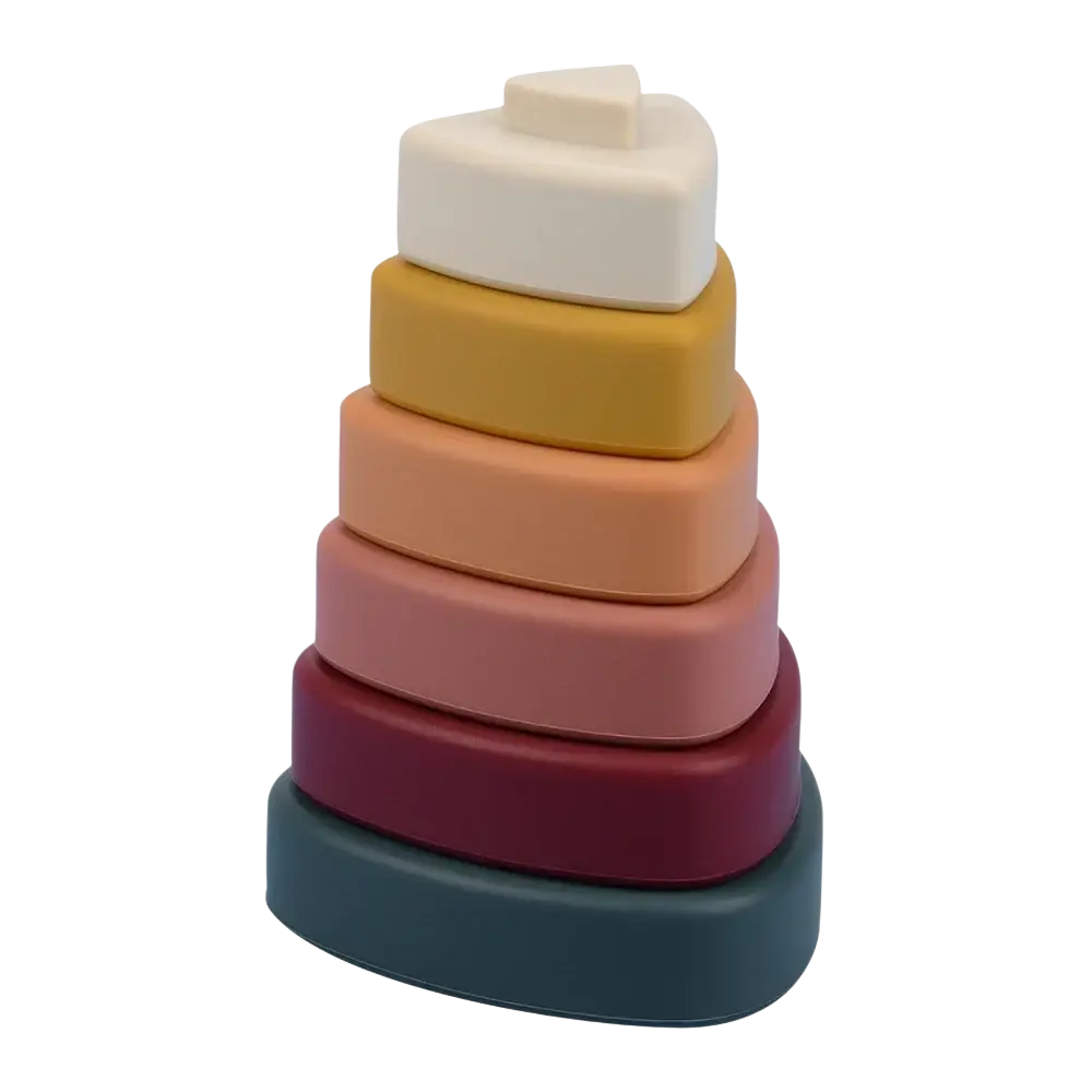 A stack of six colorful silicone stacking blocks with a matte finish in a pastel gradient for Montessori toys