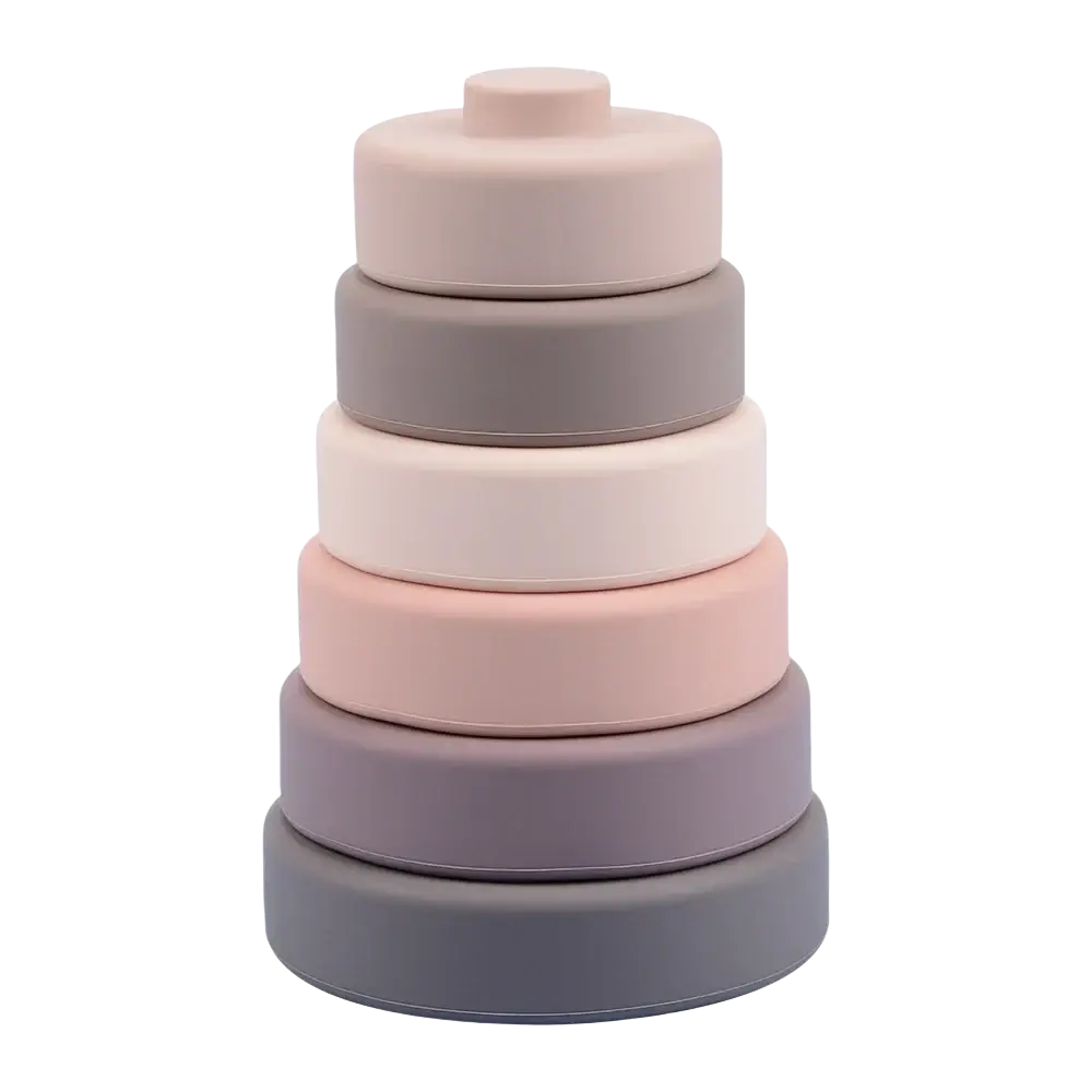 Stacked silicone nesting rings in pastel pink gray and beige for silicone stacking blocks pastel montessori toys